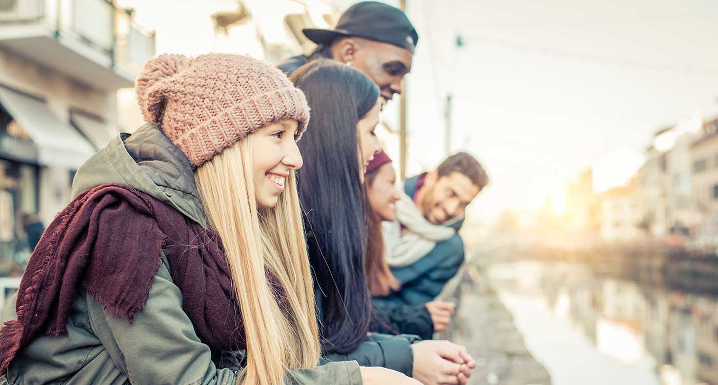 teenagers, smiling, looking out to river